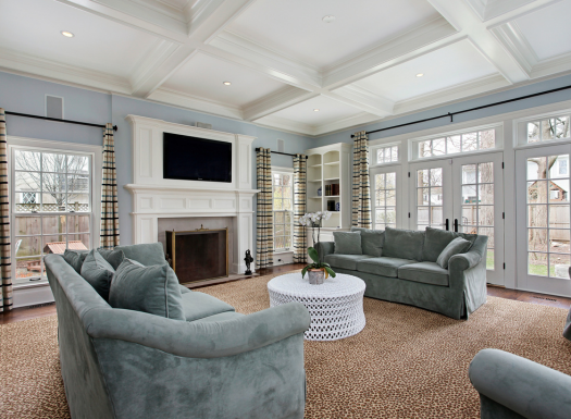 a living room with a fireplace , couch , coffee table and television .